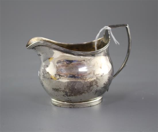 A George III silver helmet shaped cream jug, by Charles Hougham?, London, 1806, height, 85mm, 3oz.